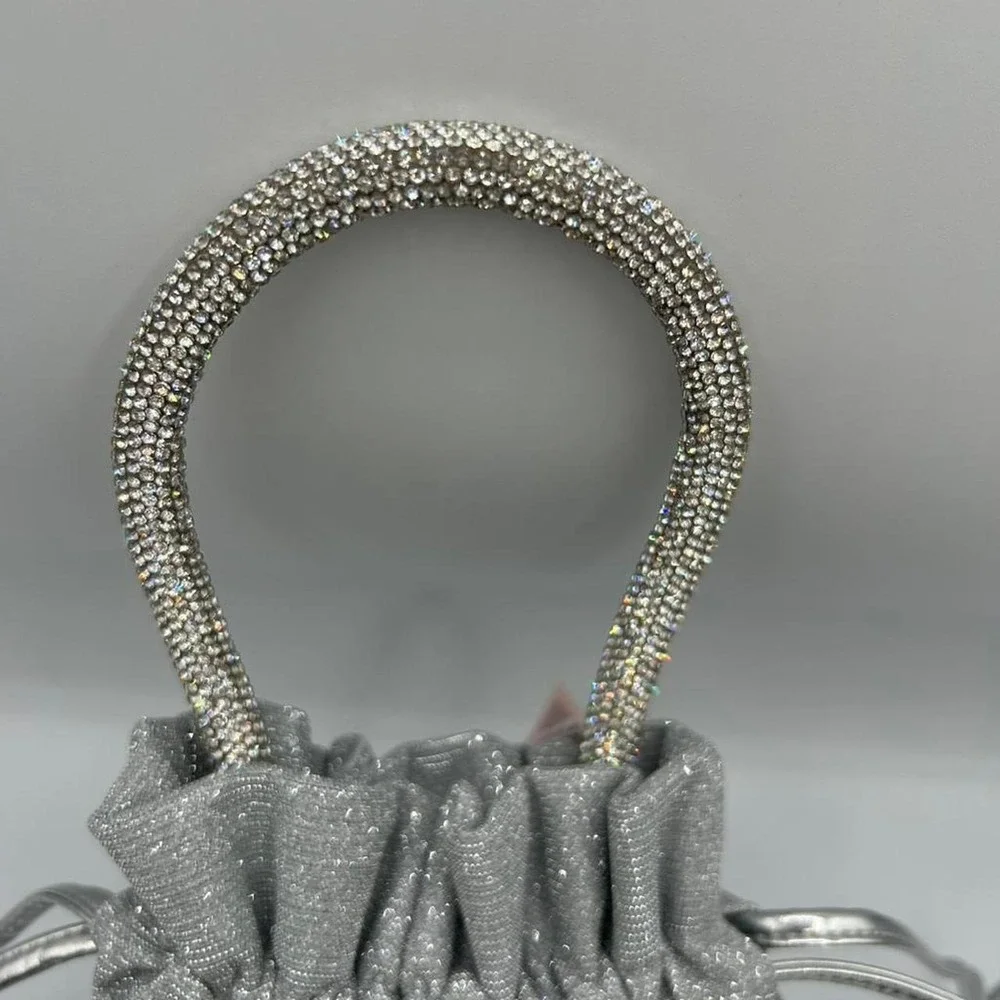 Victoria's Secret Silver glittery drawstring bag with rhinestone handle
